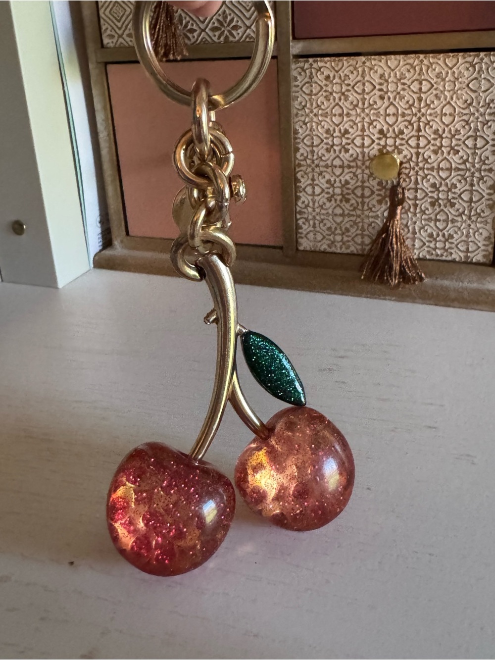 Coach Gold-Tone Cherry Keychain with Sparkling Pink Cherries and Green Leaf